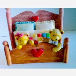 2 baby bears on bed post vintage